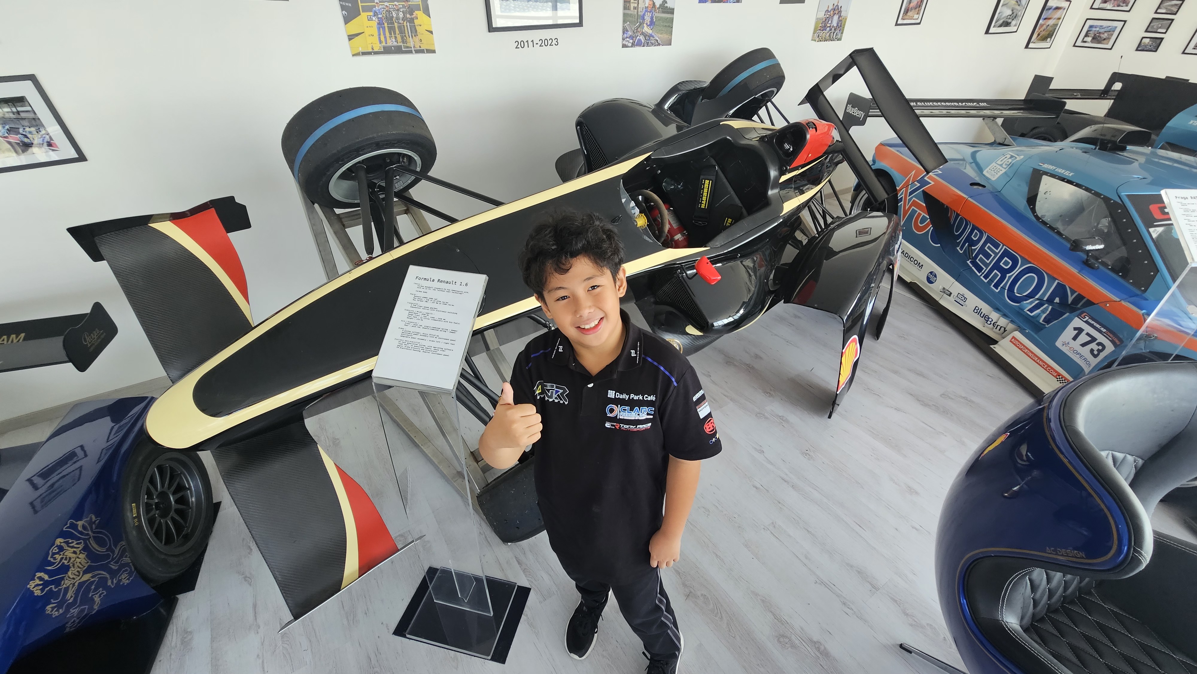 Antonio Racelis among the historic race cars at the IPKarting plant