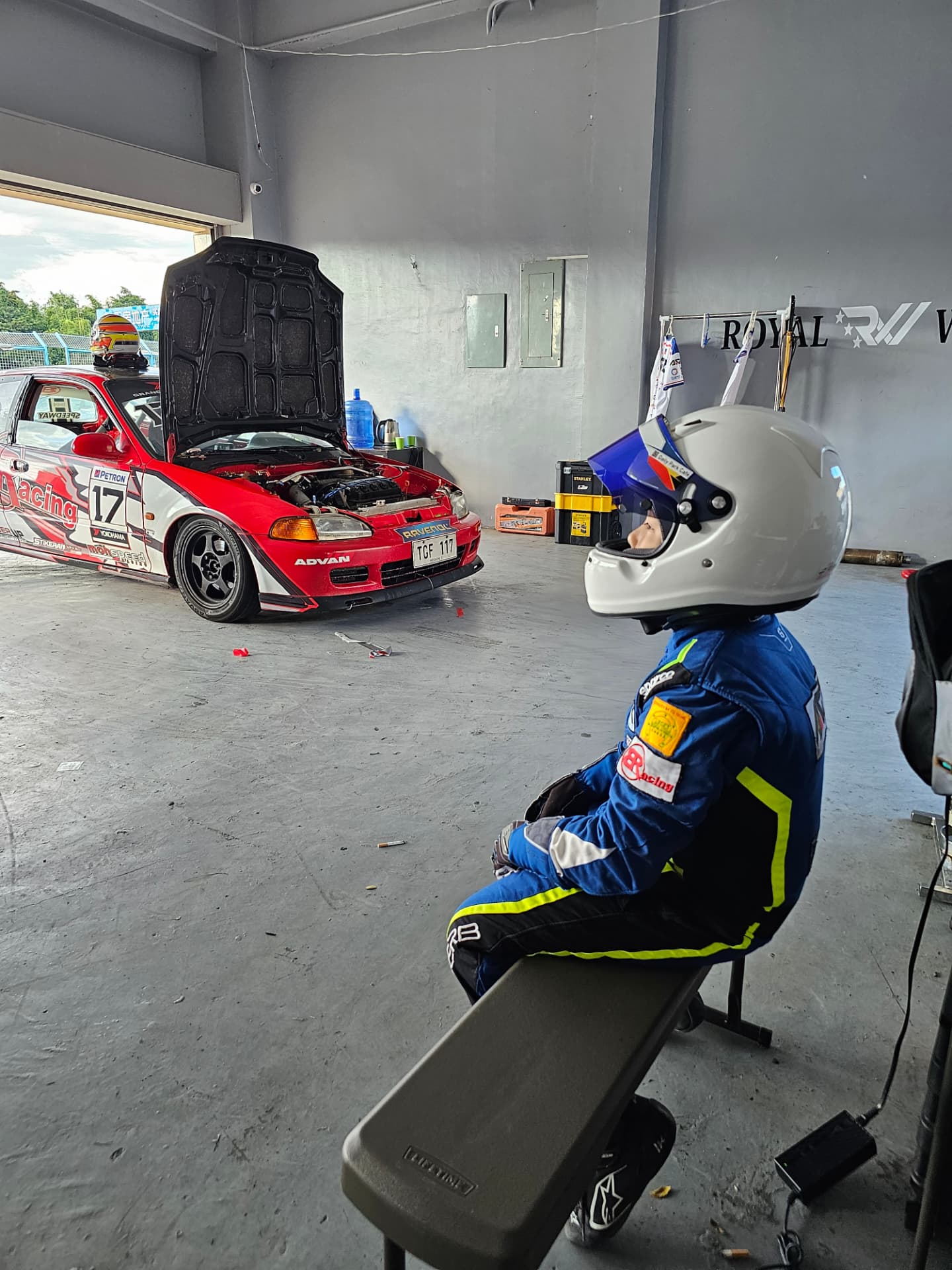 Antonio Racelis wearing his helmet in the paddock