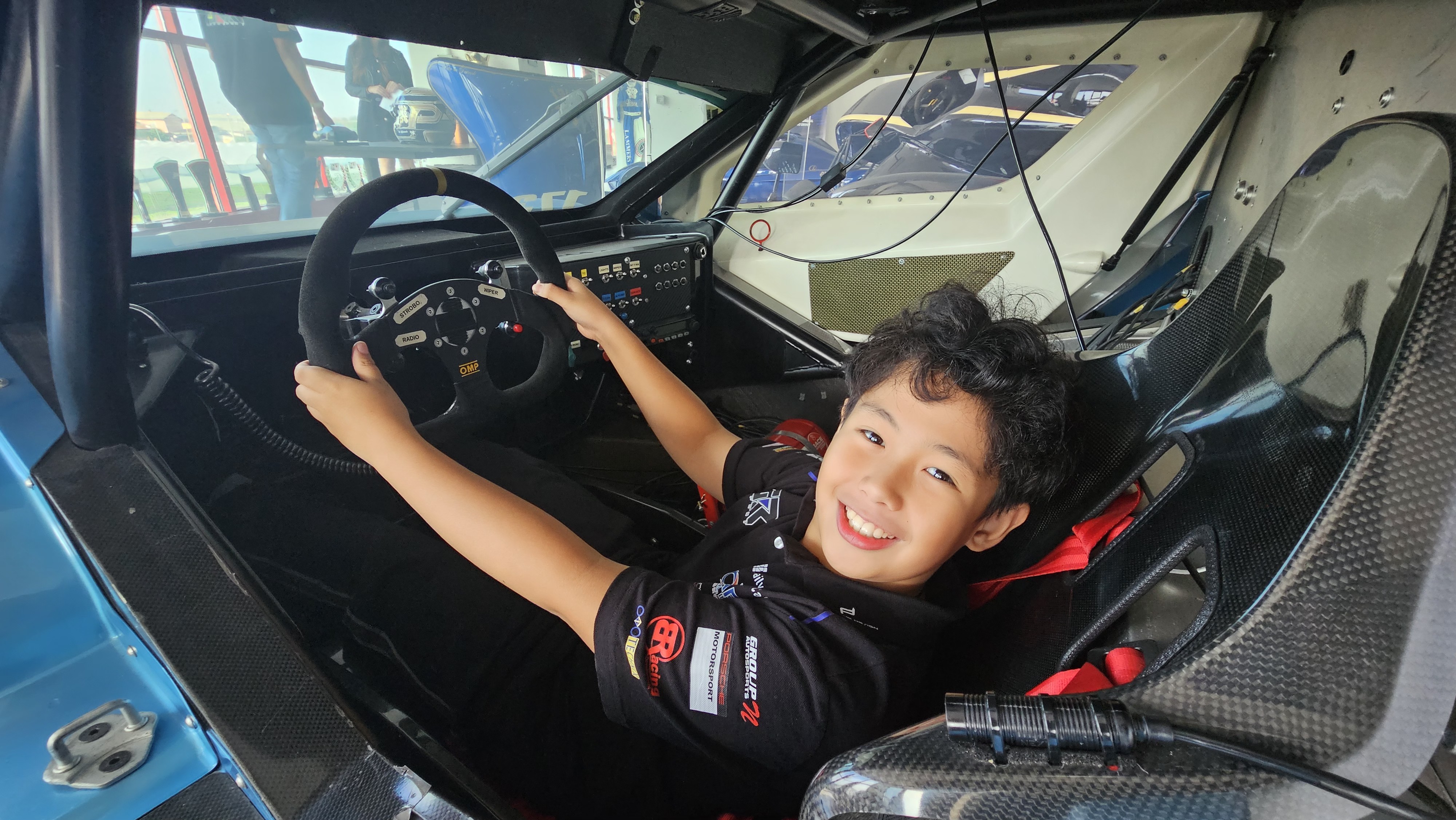 Antonio Racelis in the cockpit of a Praga race car