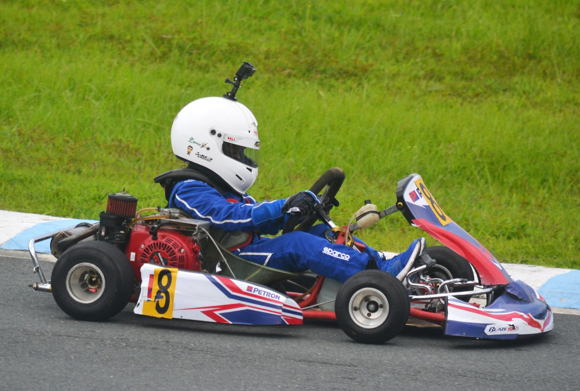 Side view of Antonio Racelis driving a kart