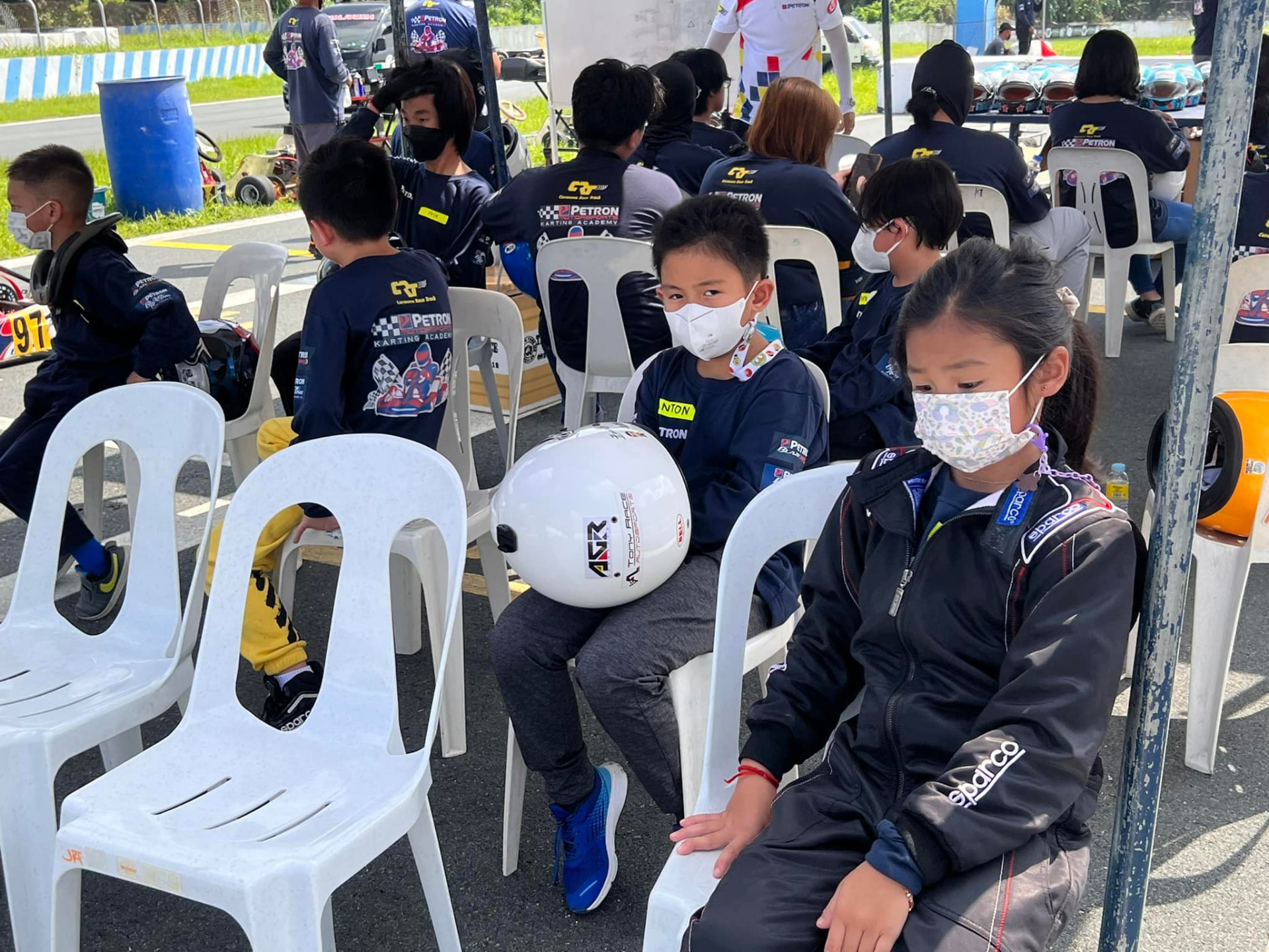 Antonio Racelis seated with other karting academy participants