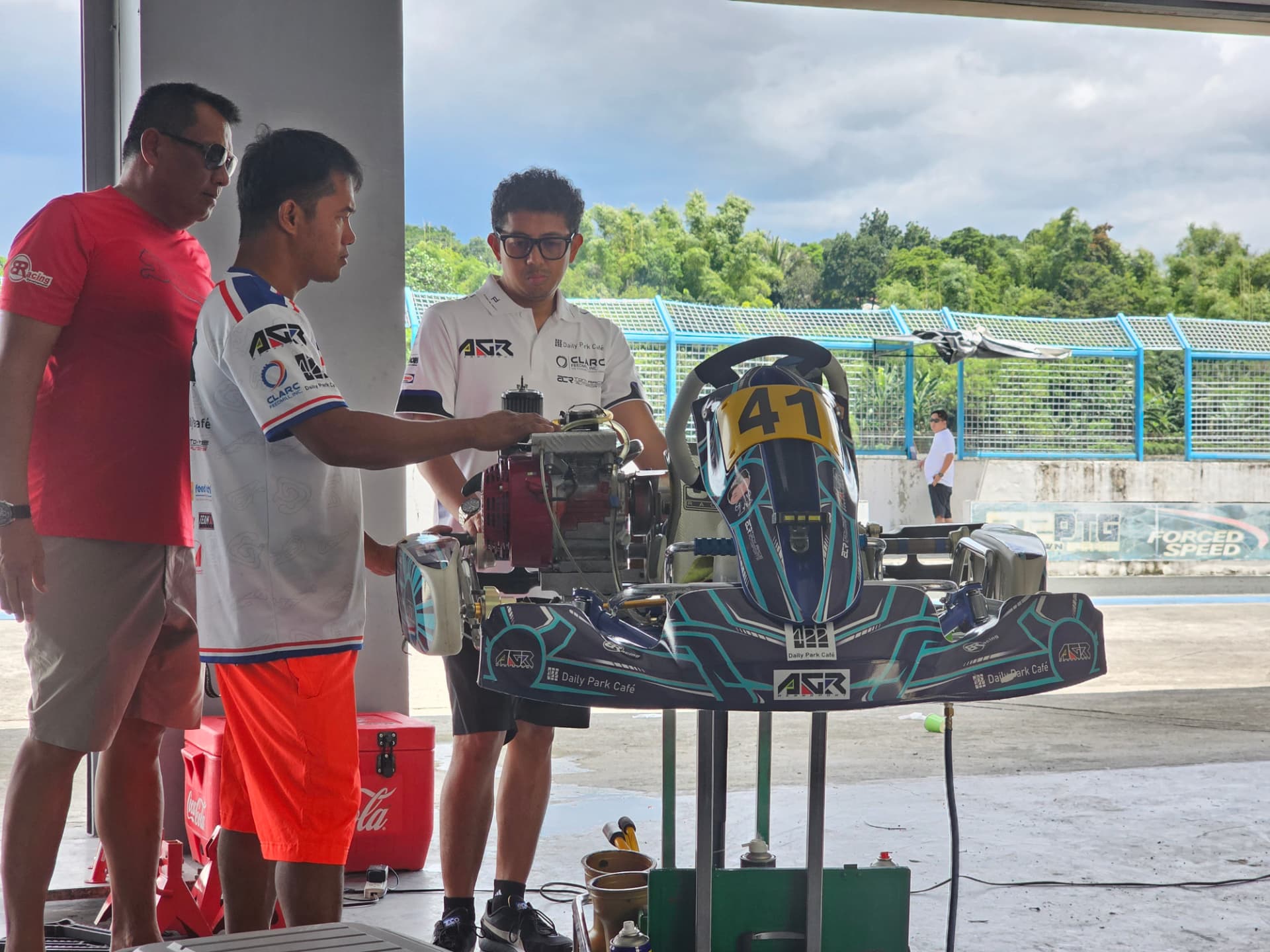 Team preparing kart number 41 in the paddock