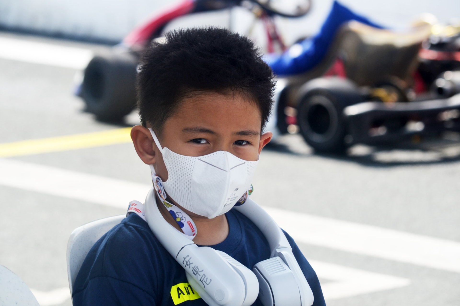 Antonio Racelis wearing a face mask by the karting track