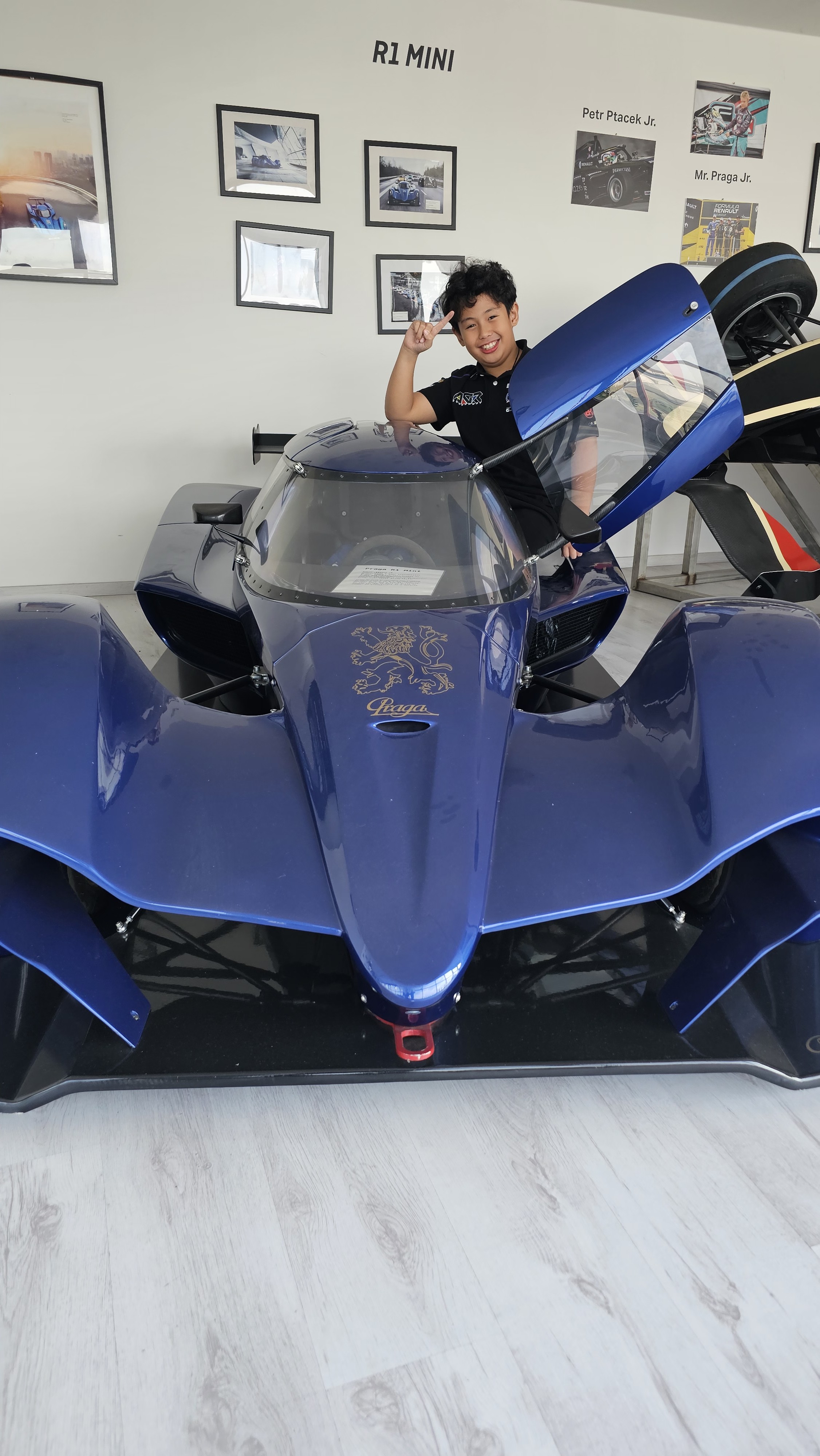 Antonio Racelis sitting in the Praga R1 Mini