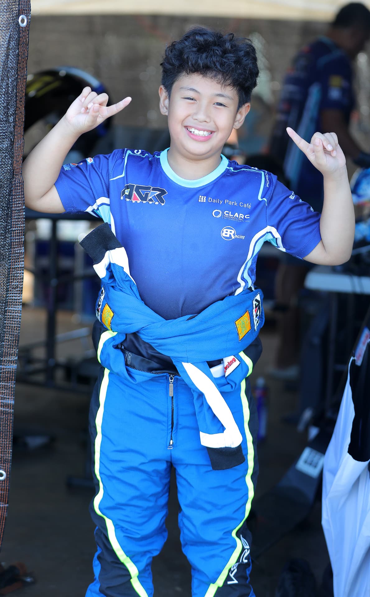 Antonio Racelis smiling in the paddock