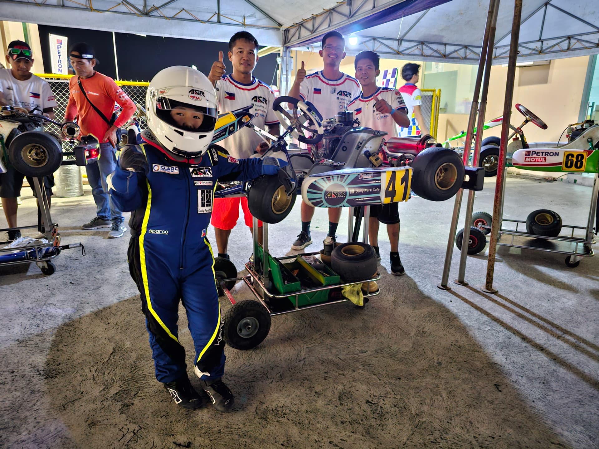 Antonio Racelis with his team and kart number 41