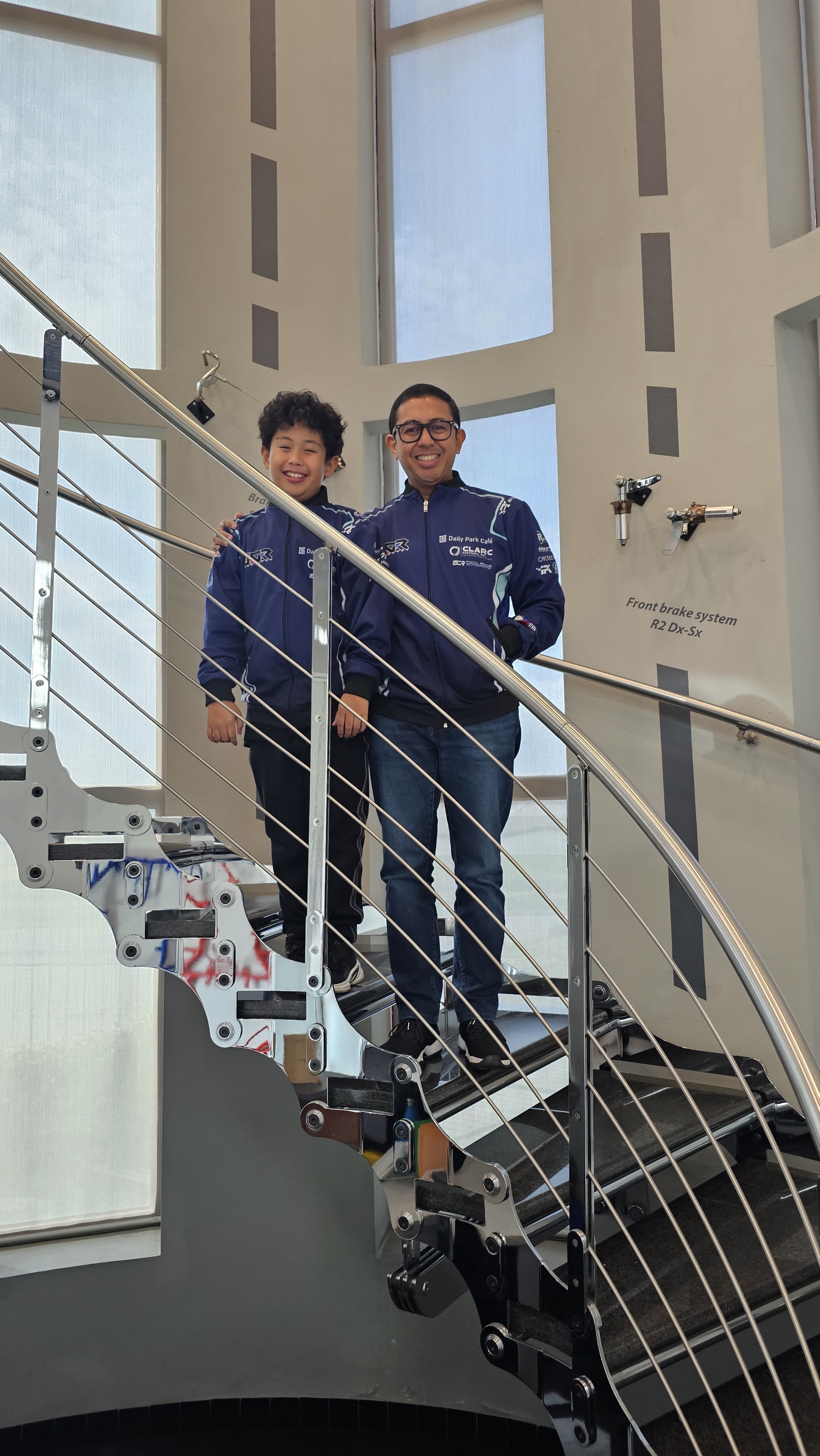 Antonio Racelis and his father among the kart component displays